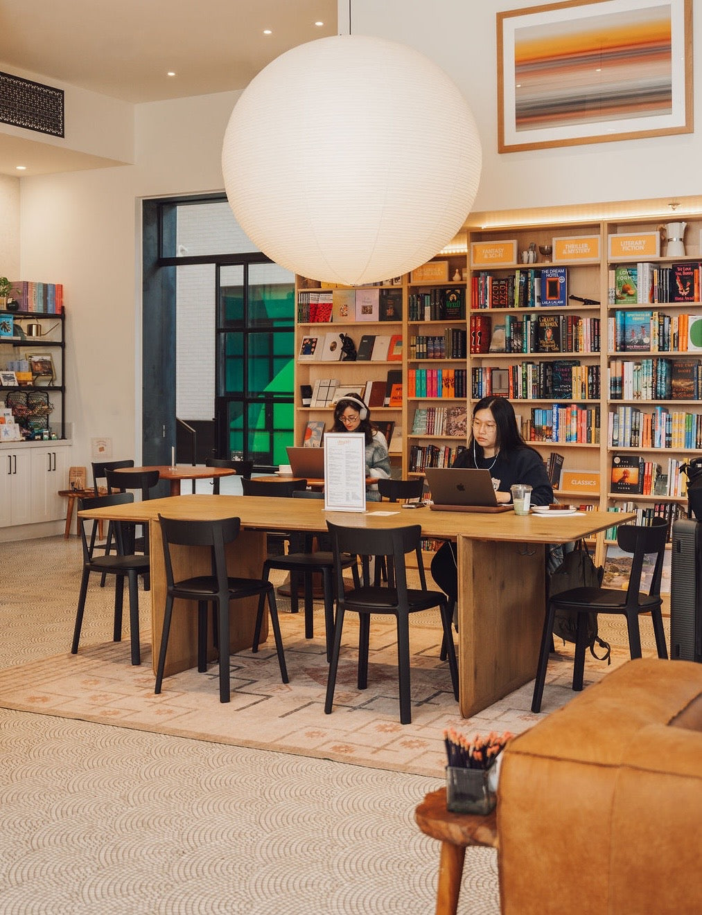 Daydrift Books & Cafe interior with framed abstract art by Morton Contemporary Art Advisory, Birch Thomas architecture, Virginia