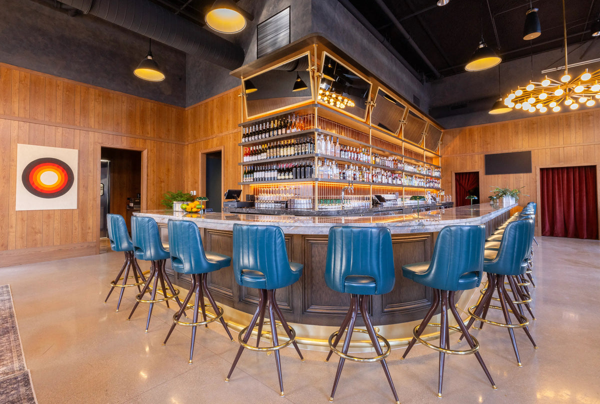 Interior picture of restaurant bar with a mid-century style with art curated by Morton Contemporary Art Advisory