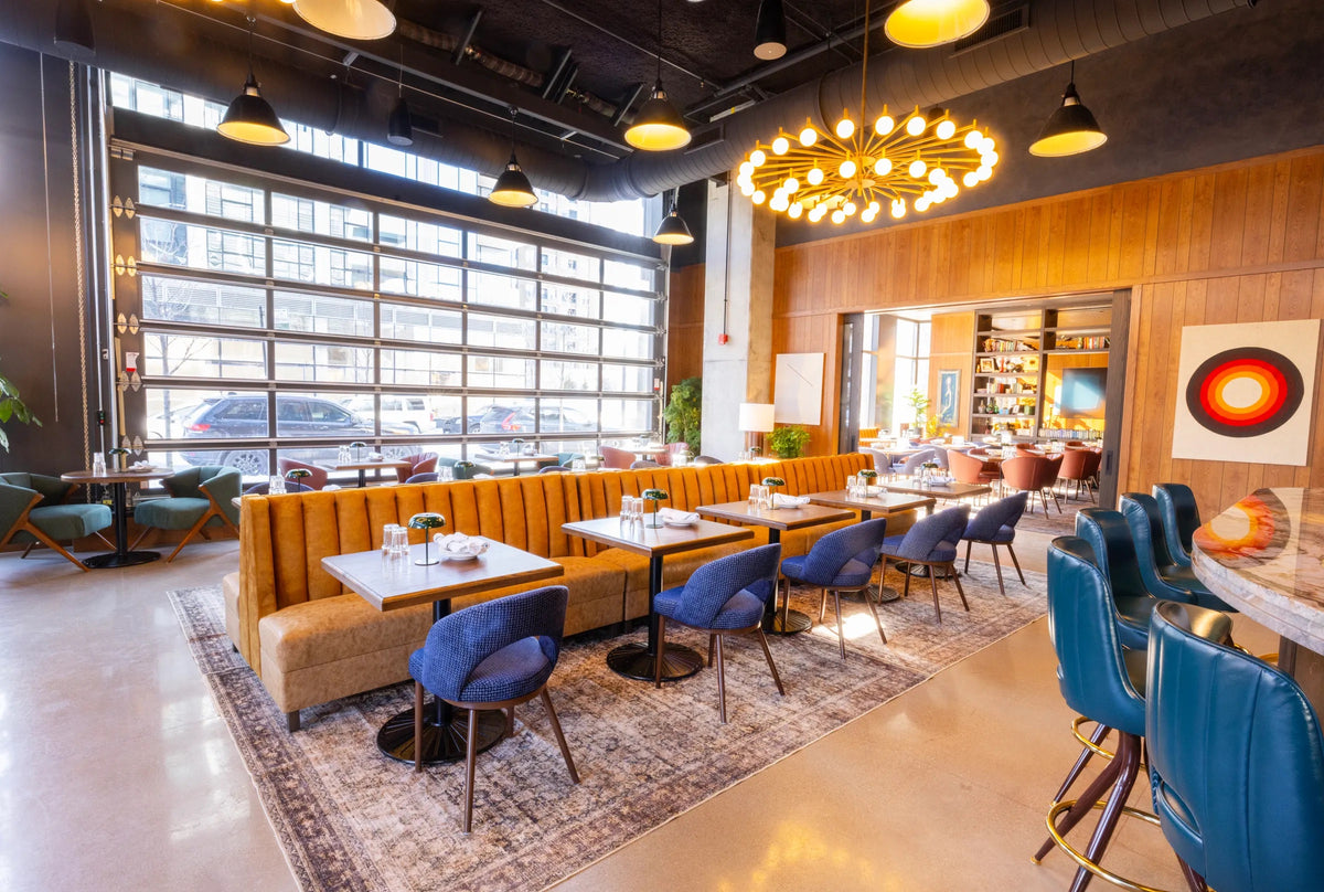 Interior photograph of a restaurant with a mid-century modern style with artwork curated by Morton Contemporary Art Advisory