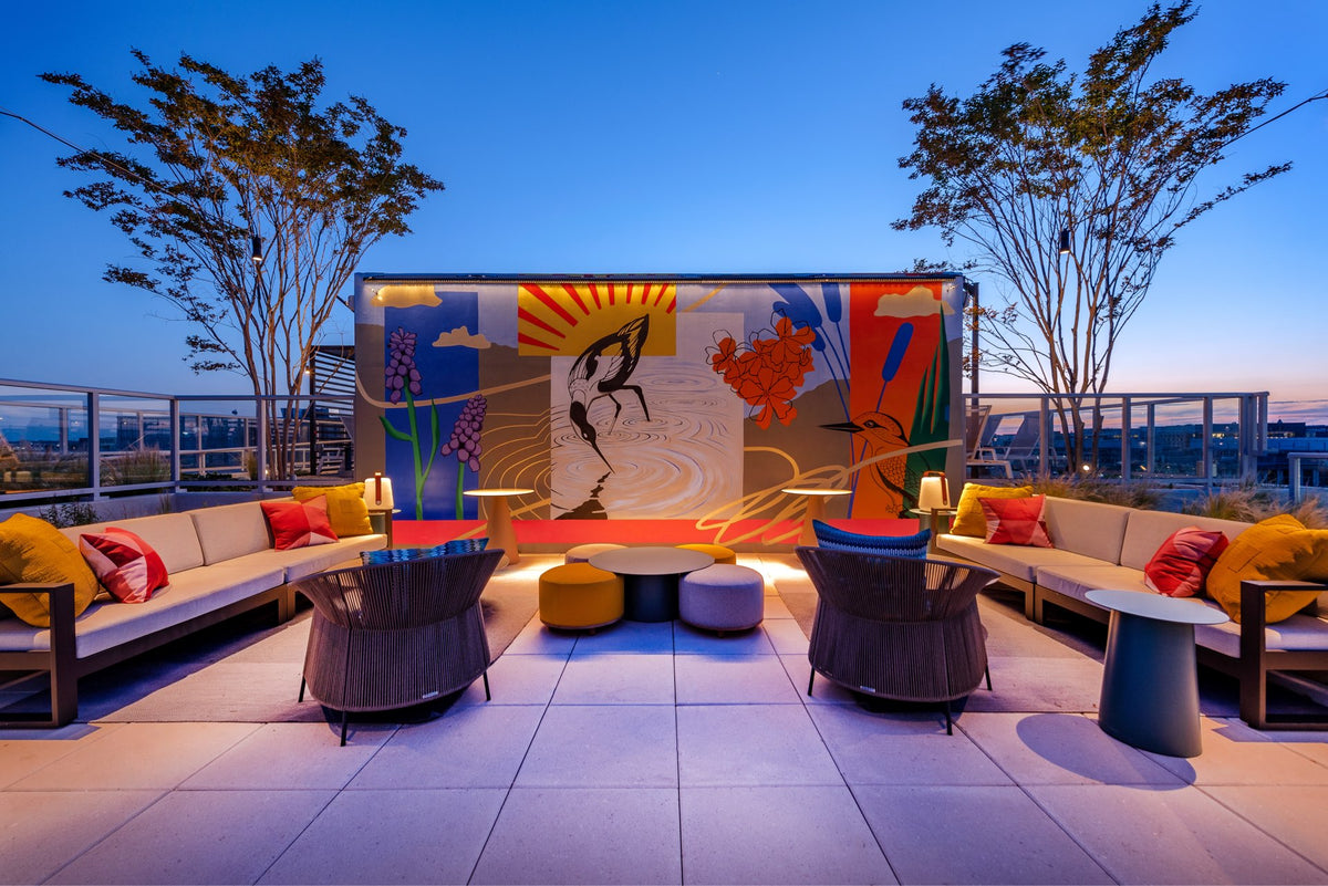 Modern outdoor Mural of birds and plants on a rooftop lounge at dusk for Gallery 64 by Morton Contemporary Art Advisory